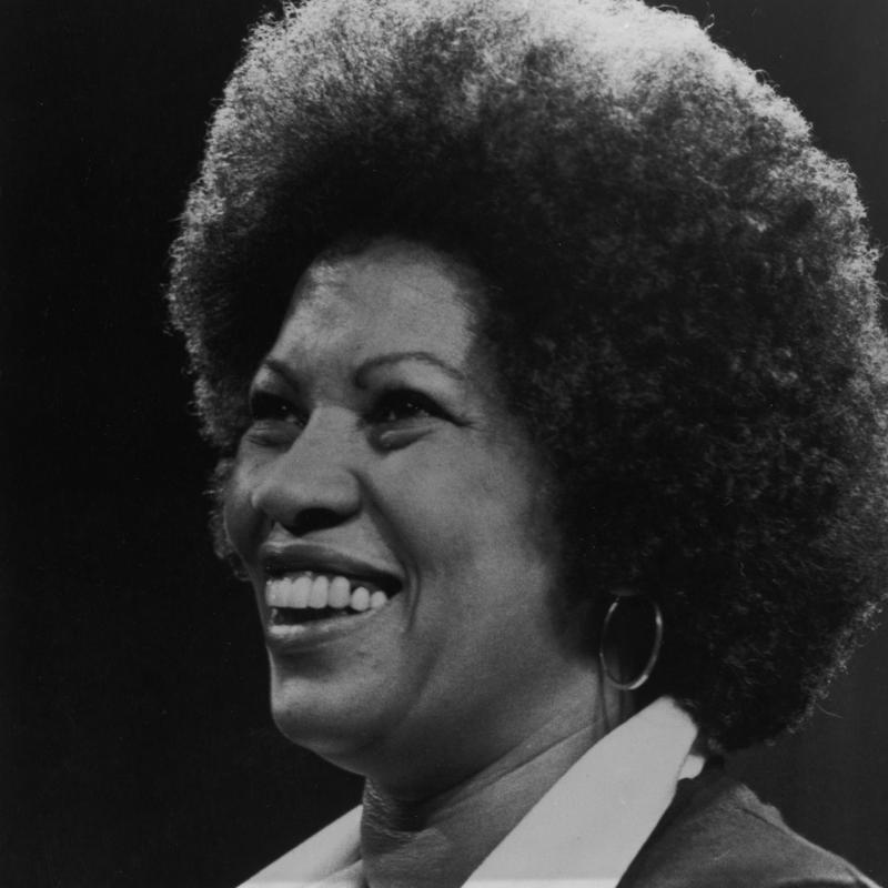 Toni Morrison looks off-camera in a black and white photo from 1977